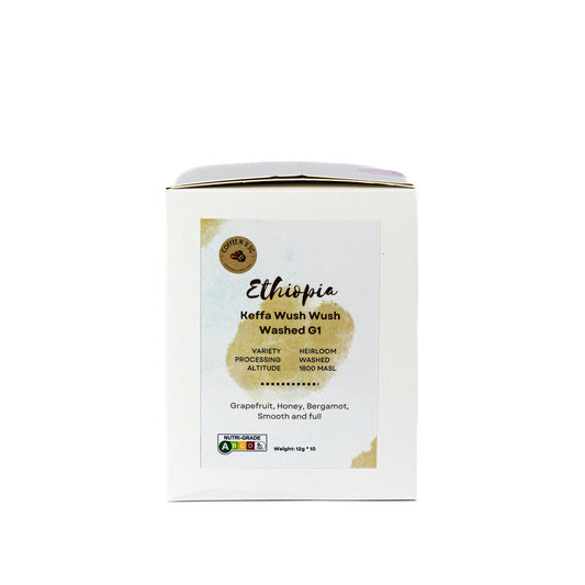 White coffee packaging with gold accents on a white background